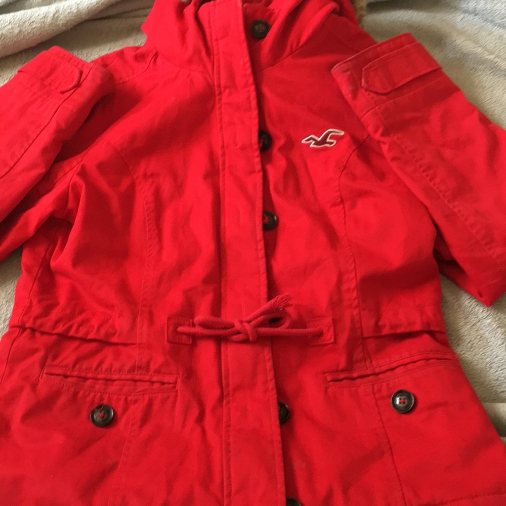 It’s a winter jacket that has fur and it’s red